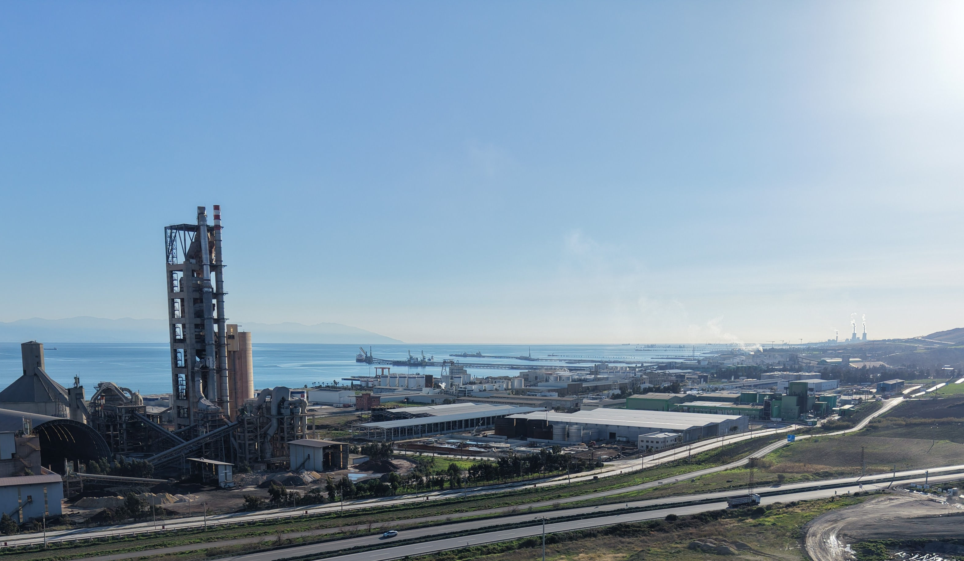 Aerial view of Ceyhan Organised Industrial Zone and its surroundings: factories, the motorway and the port.